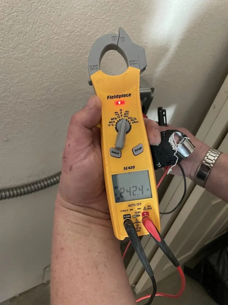 Voltage testing with clamp meter during Electrical Installation Services in Morristown